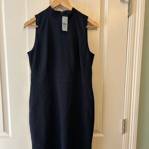 Navy sheath dress with small polka dots. Very flattering and comfortable. NWT